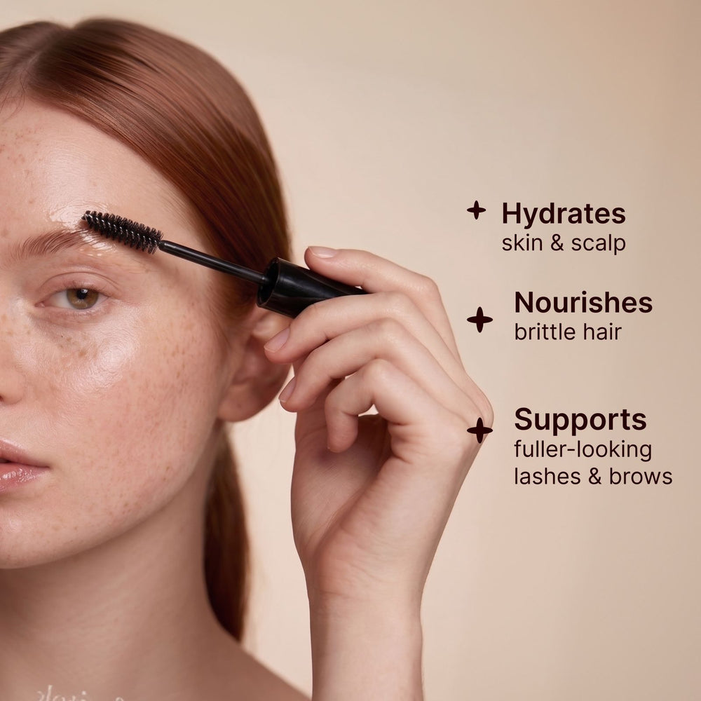 Woman applying Soulsation Organic Castor Oil to eyebrows with the included precision applicator for healthy-looking brows.